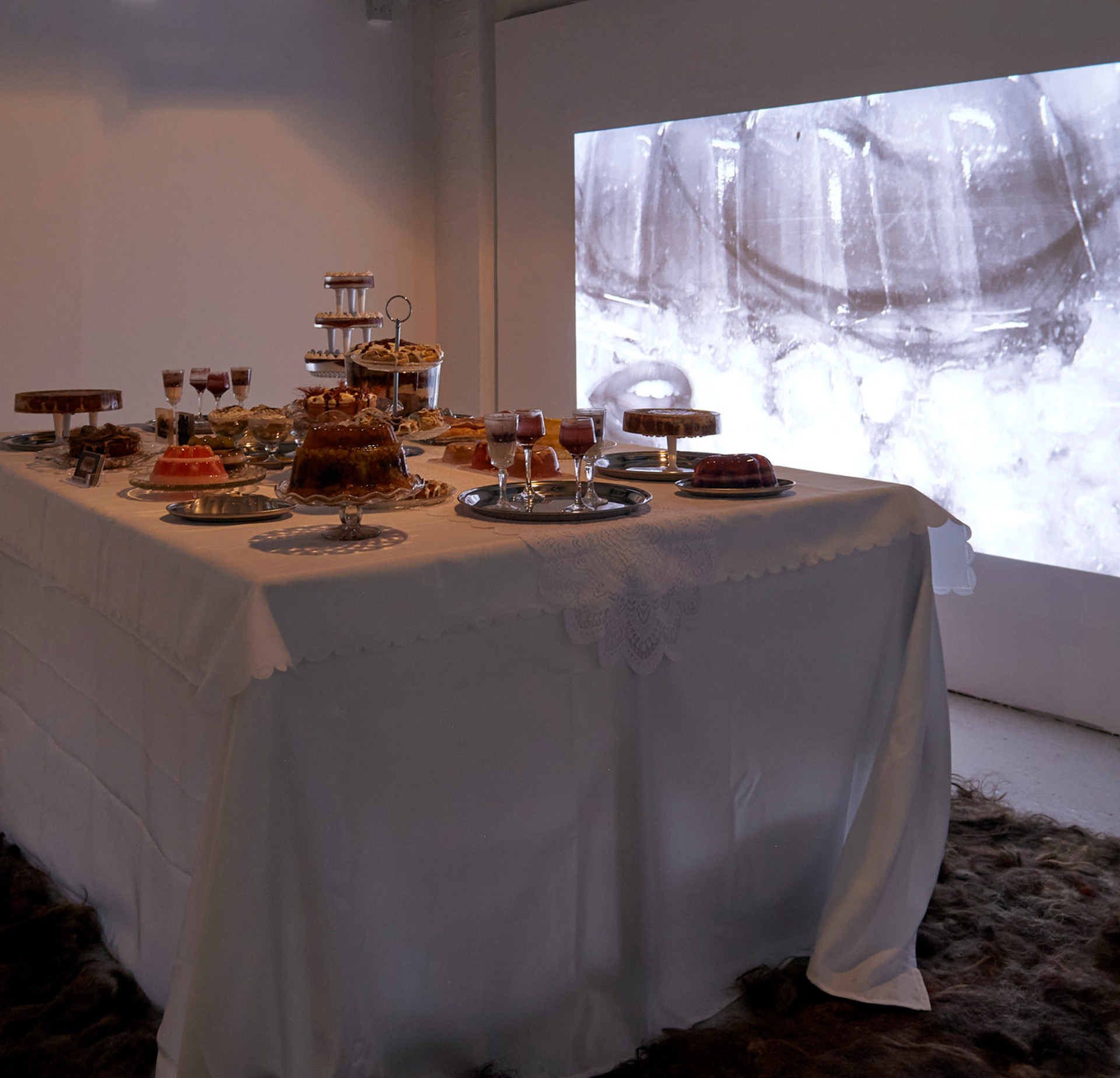 BA Fine Art work by Chloe Lees showing a table decorated with jellied foods and other items.