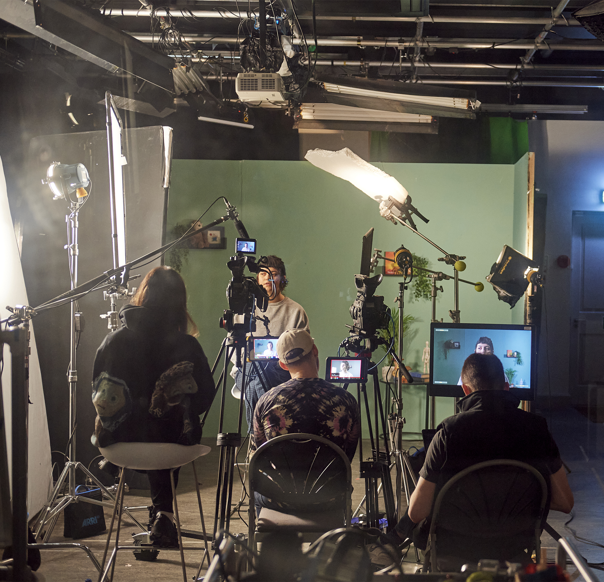 Film students working on a set built in the Film Studio with an Acting student.