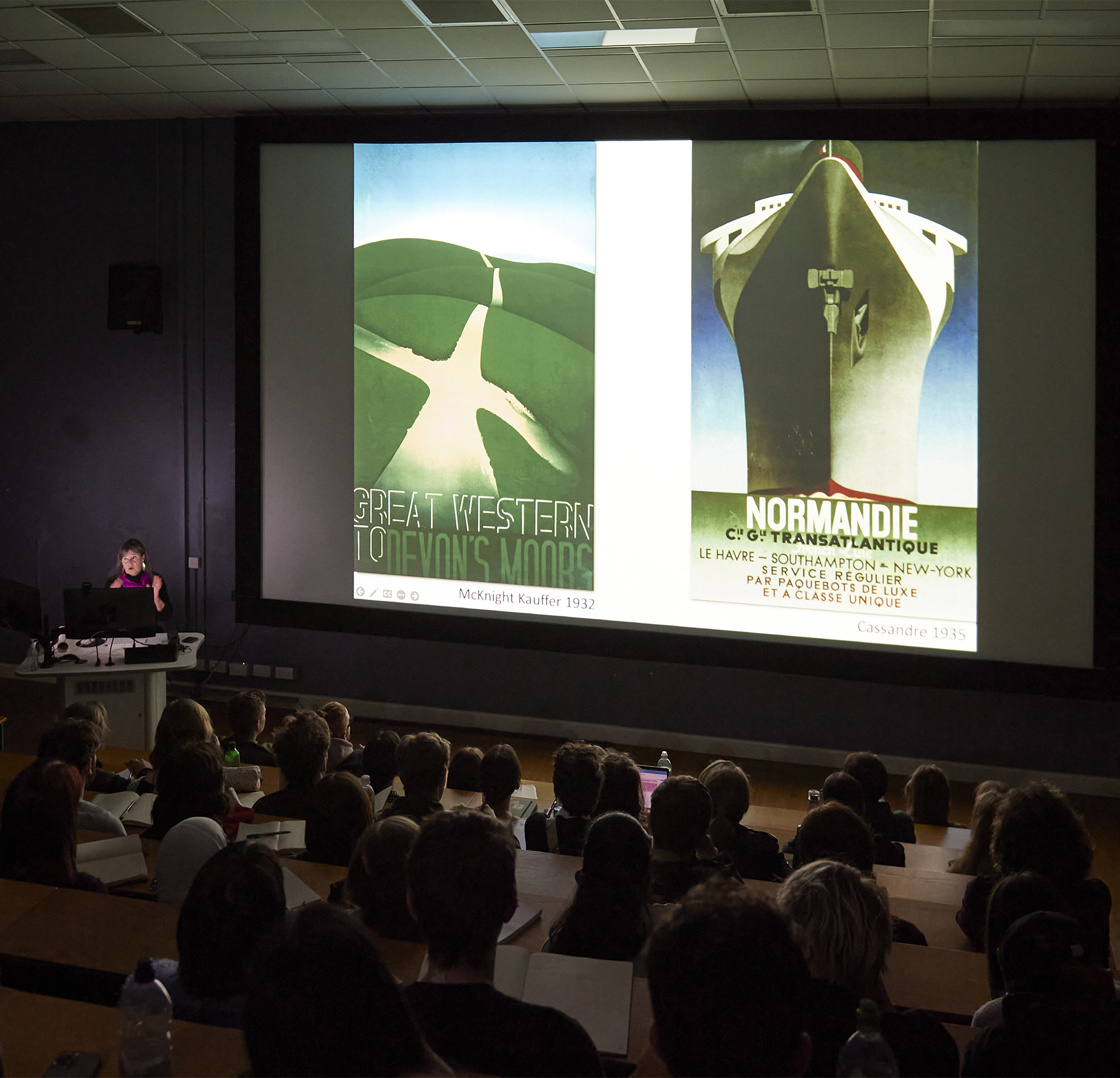 Graphic Design lecture showing 1930s poster designs to a lecture theatre full of students.