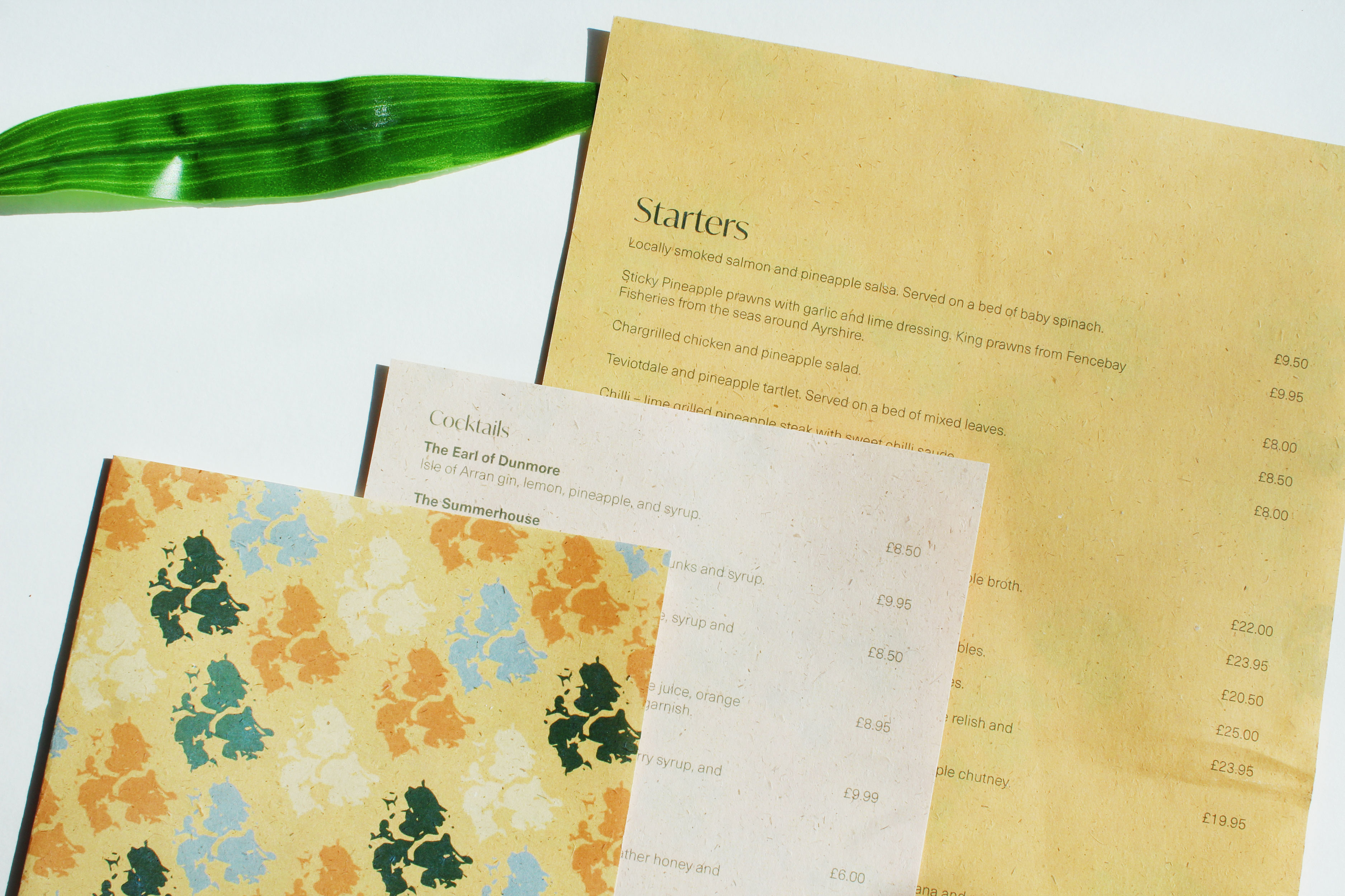 BA Graphic Communications work by Ellie Russell showing a restaurant menu based on pineapples.