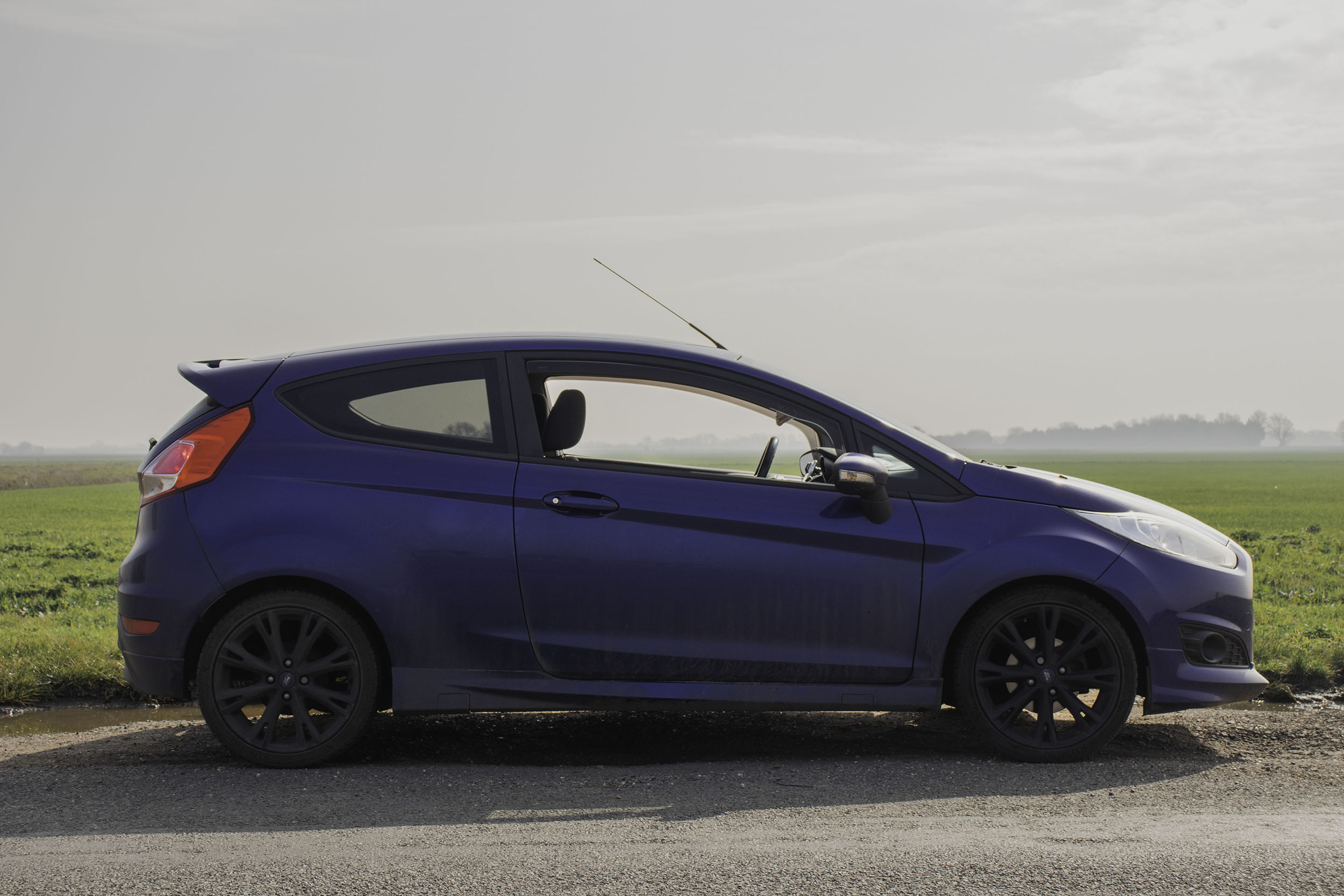 BA Photography work by Georgia Wilding-Glendye showing the exterior of a Ford Fiesta ZS as the landscape behind is filled with mist.