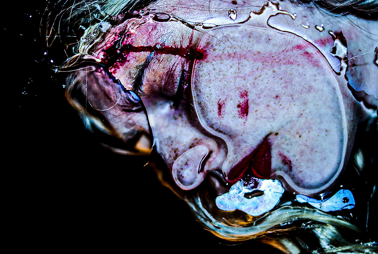 BA (Hons) Photography work by Harriet Atenia shows a colourful and surreal image depicting a submerged female subject.