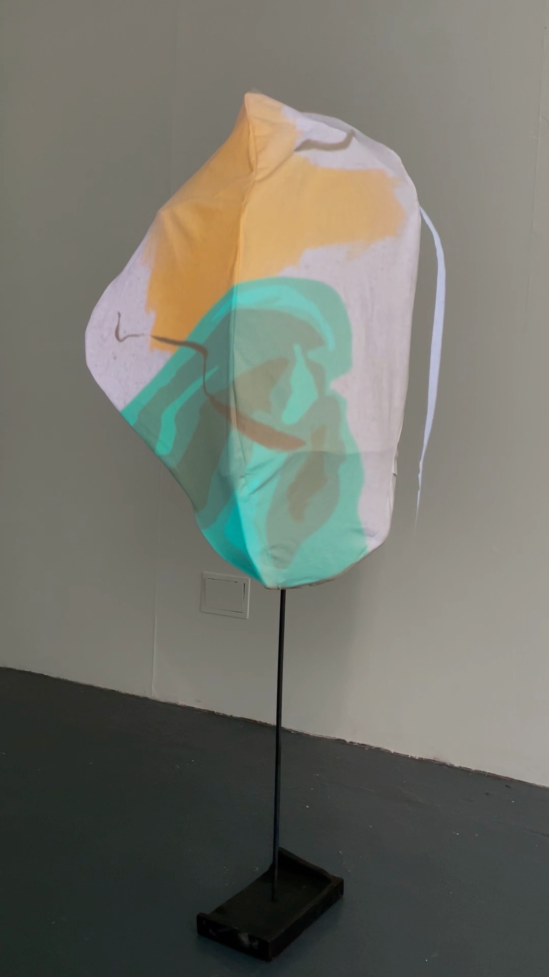 Video of BA Fine Art sculpture by Honor Alys Fraser. A canvas and steel sculpture, a blue and yellow animation is projected onto the canvas. Black ink is drawn across the animation in a loop