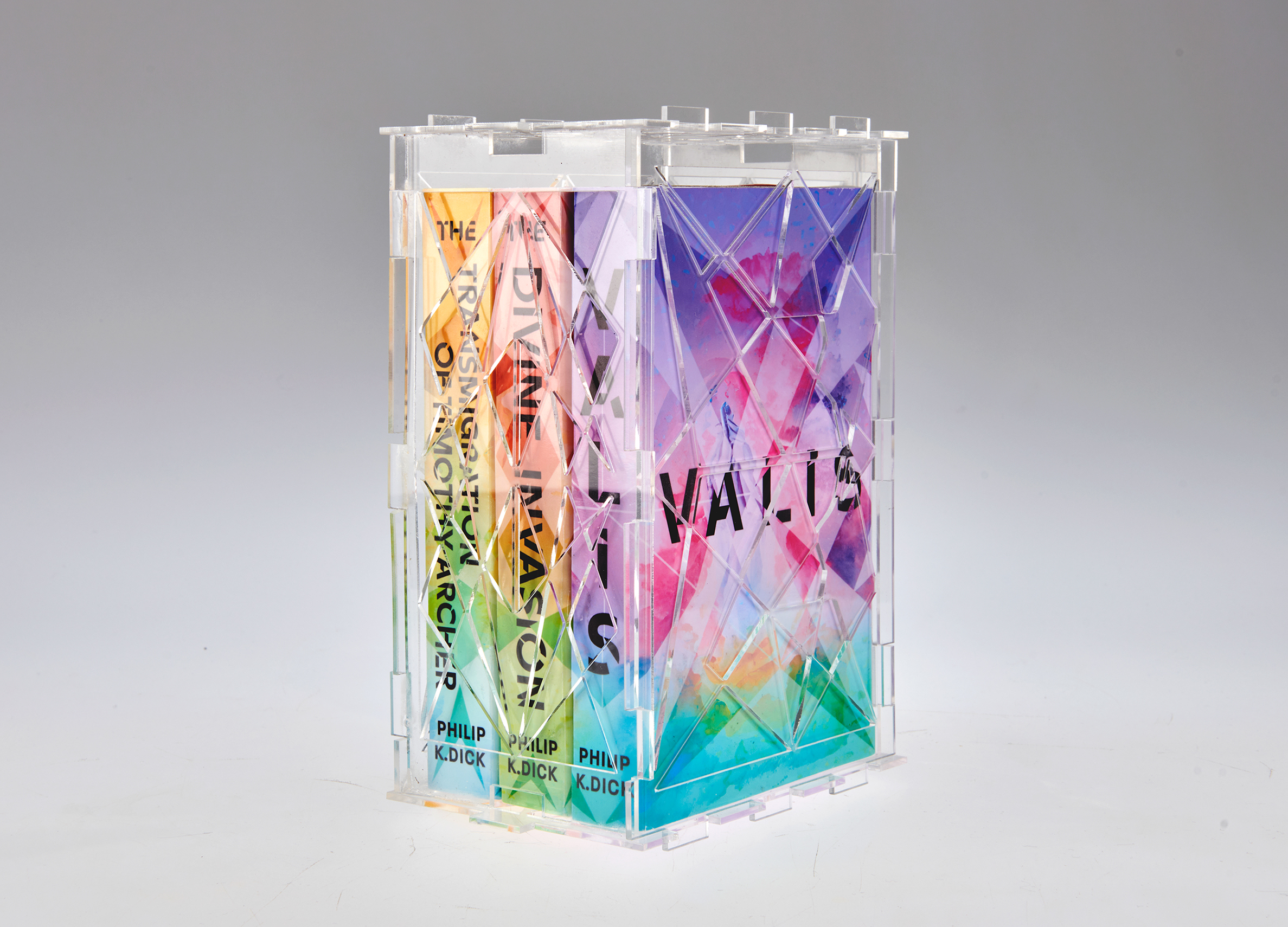 Book box set for Philip K Dicks Valis trilogy designed by Jake Cook. Featuring colourful connecting covers and a transparent collectors case.