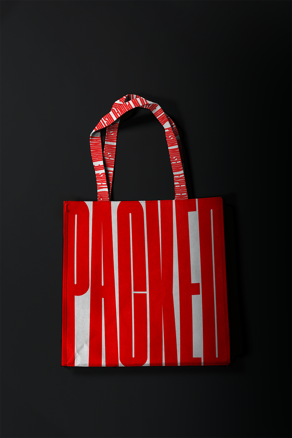 BA Graphic Communication work by Lara Mortimer showing a branded tote bag with the word 'packed' in condensed lettering.