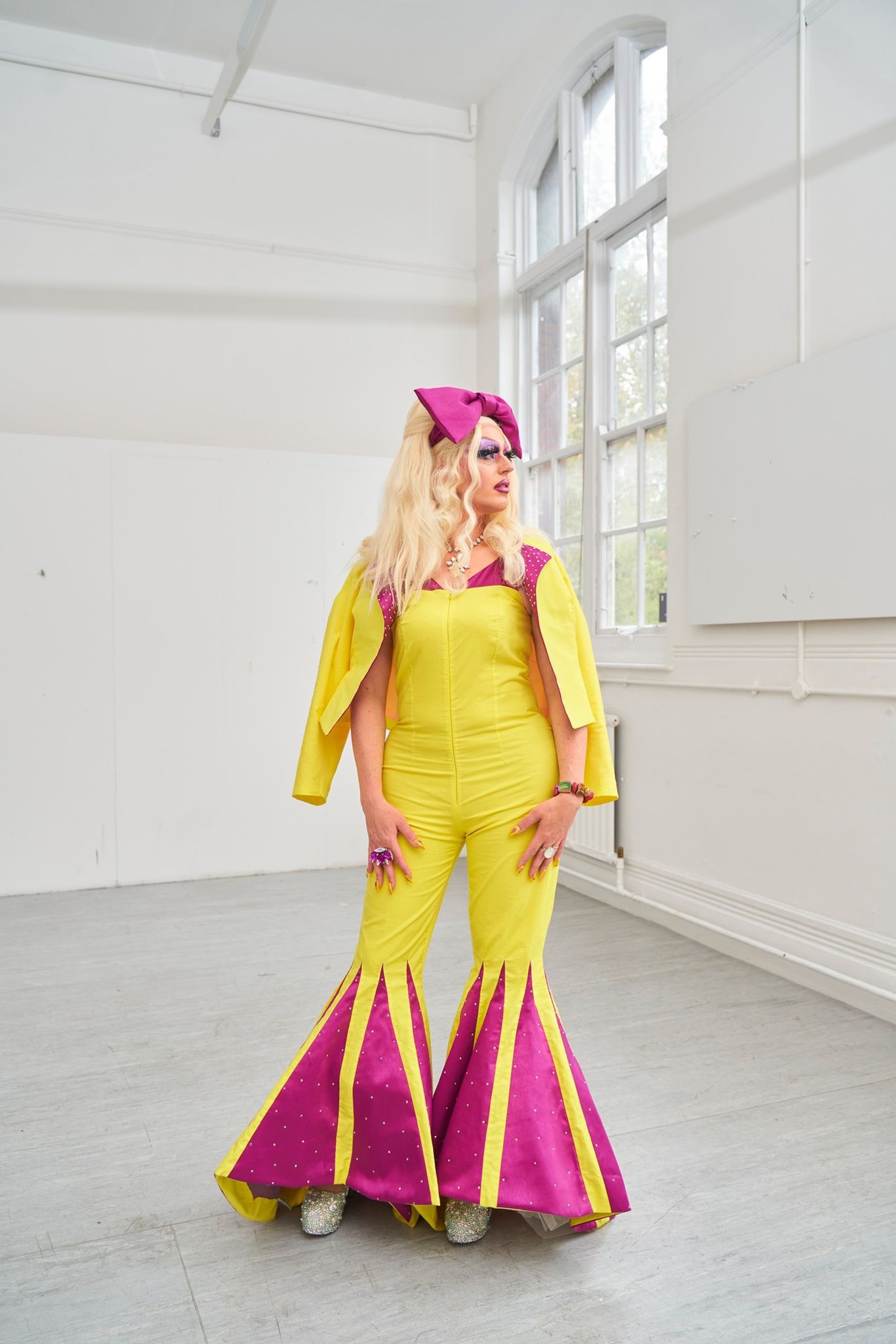 Miss Dee Licious, a Norwich based drag queen wearing a flared jumpsuit and blazer that I and another student created for an additional project