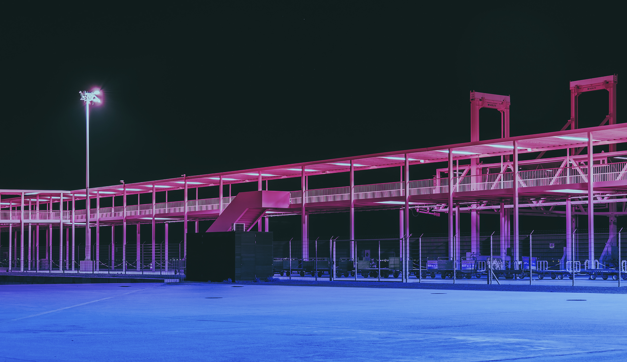 BA Photography work by Miguel Jones showcasing a colourful modern architectonic space at night