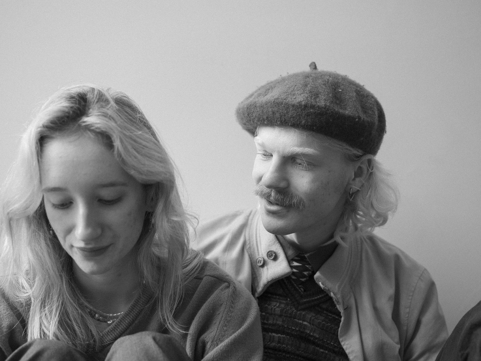 BA Photography work by Nicola Faye Bates showing a portrait of couple talking with each other.