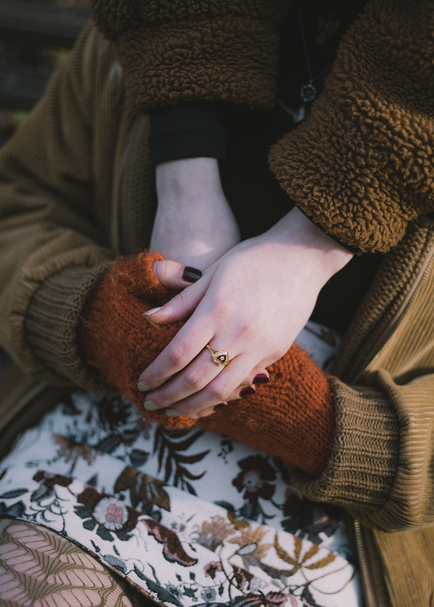 BA Photography work by Nicola Faye Bates showing a colourful portrait of a couple's hands intertwined.