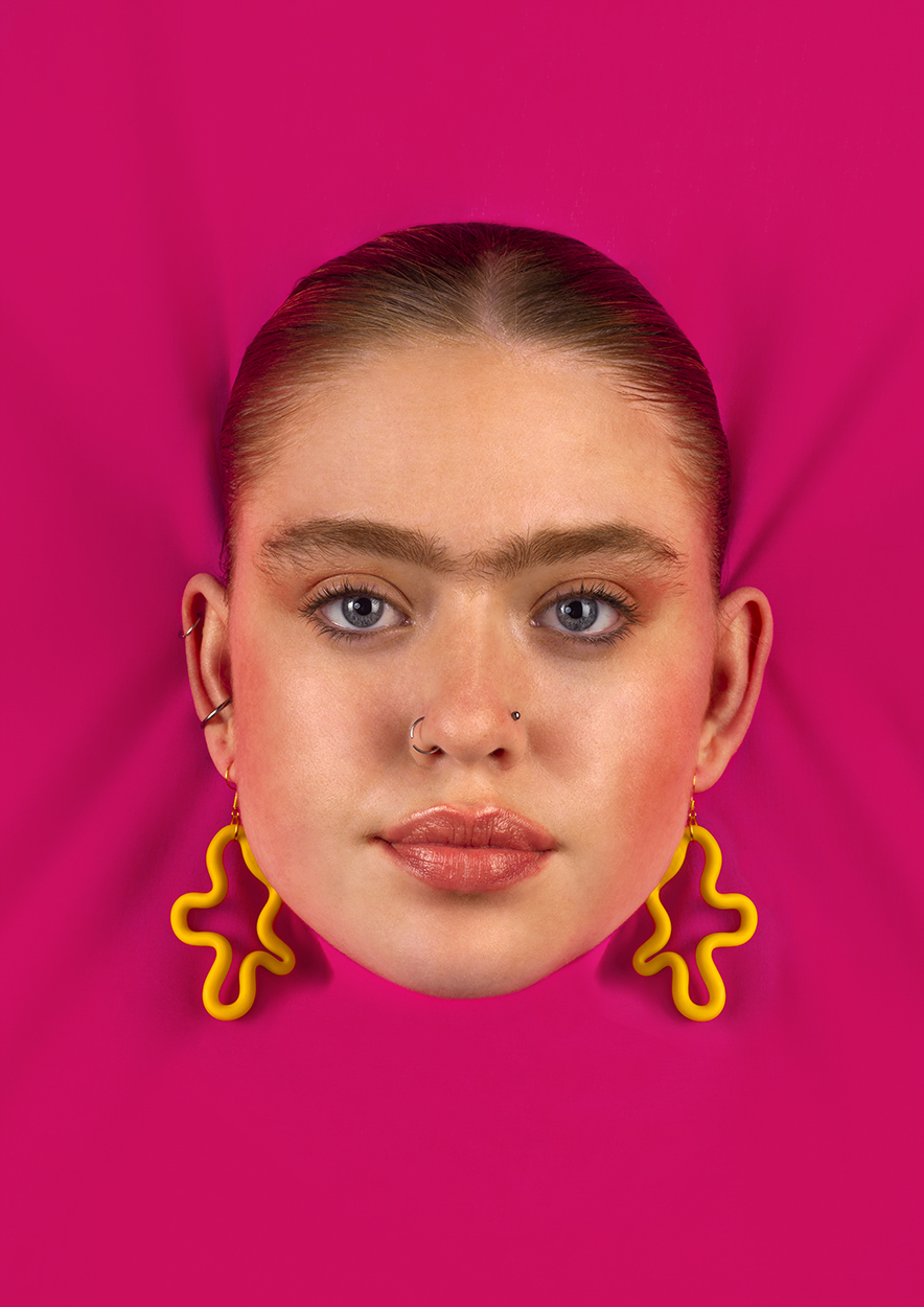 BA Photography work by Becca Stevenson showing a floating head wearing abstract, yellow earrings against a hot pink backdrop.