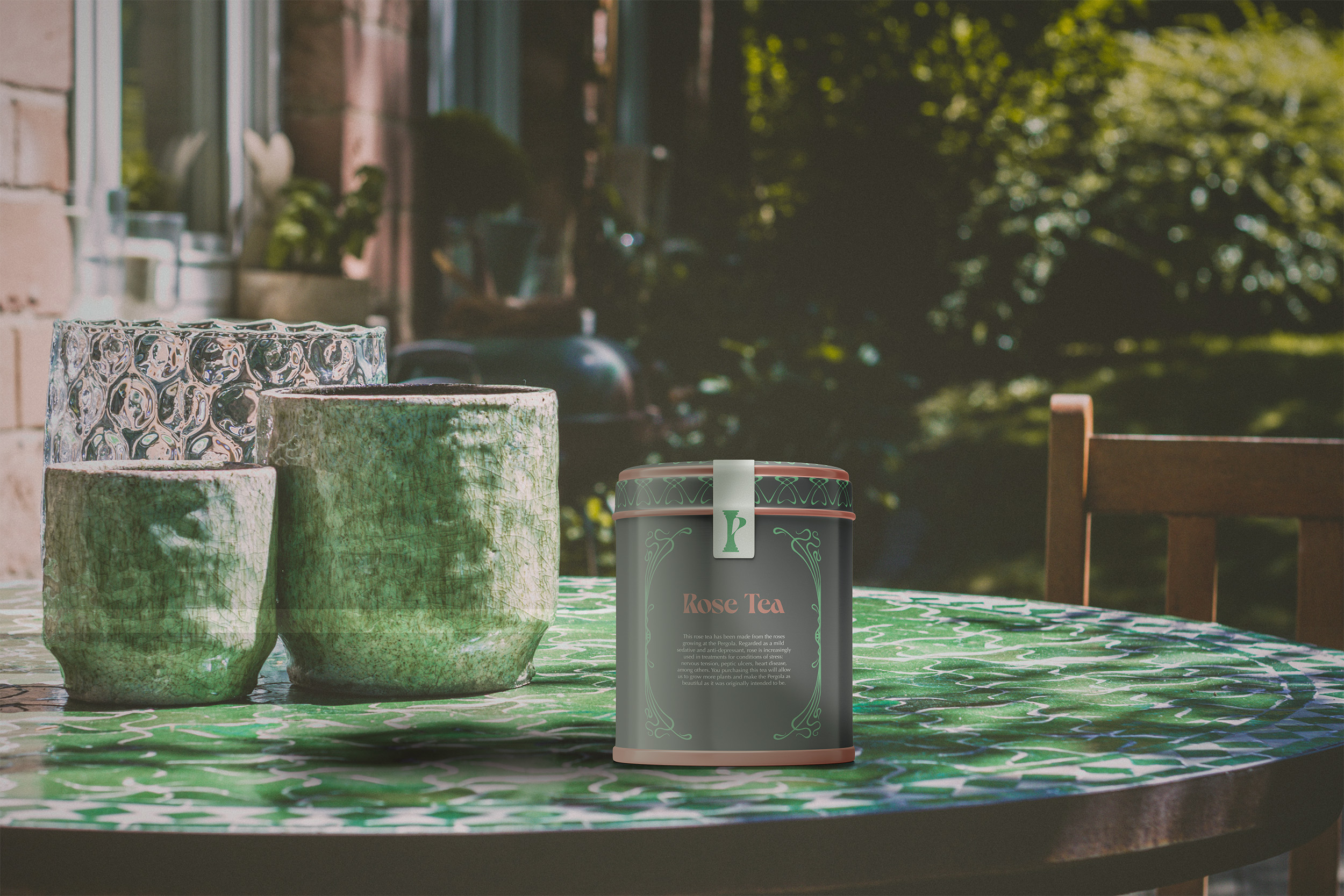 A tin of Pergola's own tea brand designed by Tatiana Diakonova, BA Graphic Communication, on top of an outdoor table.