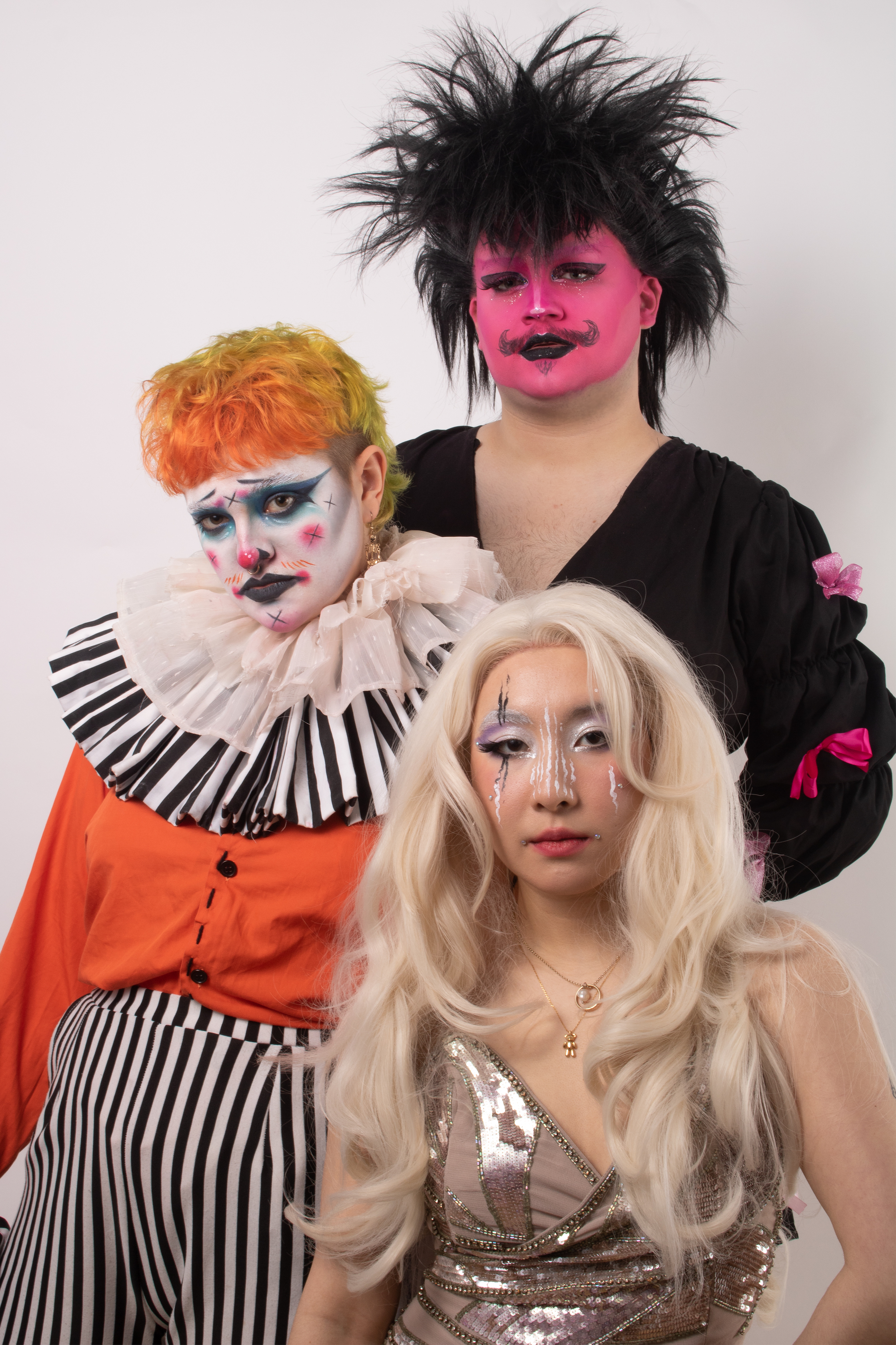 3 people in carnival circus themes costume