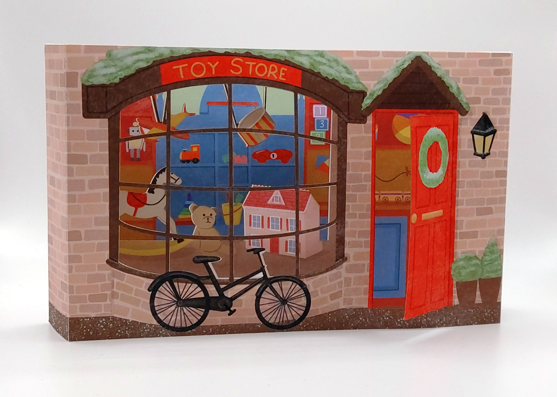 An image of a 3D greeting card in the shape of a Toy Shop by Armani Wilson.