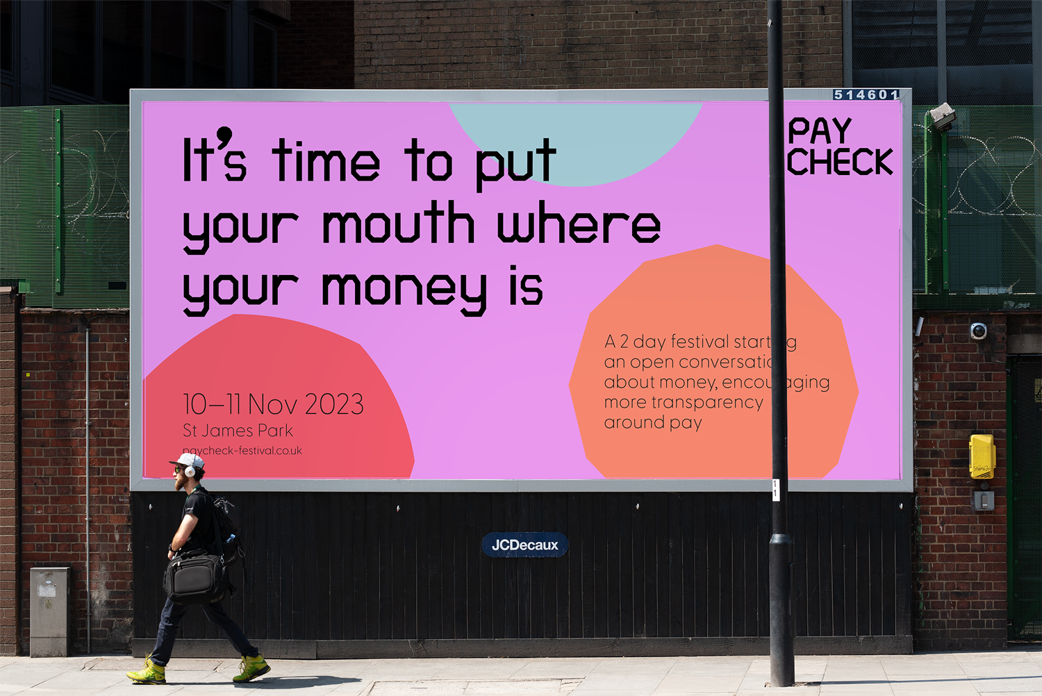 Billboard showing colourful poster advertising Paycheck festival.