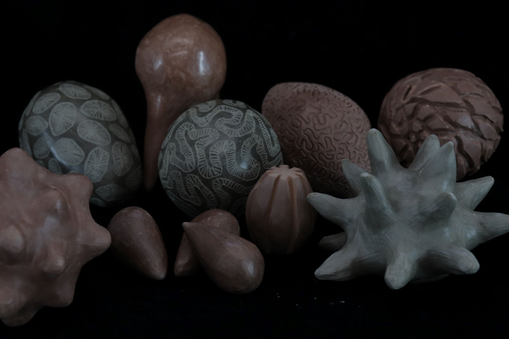 a group of abstracted clay forms