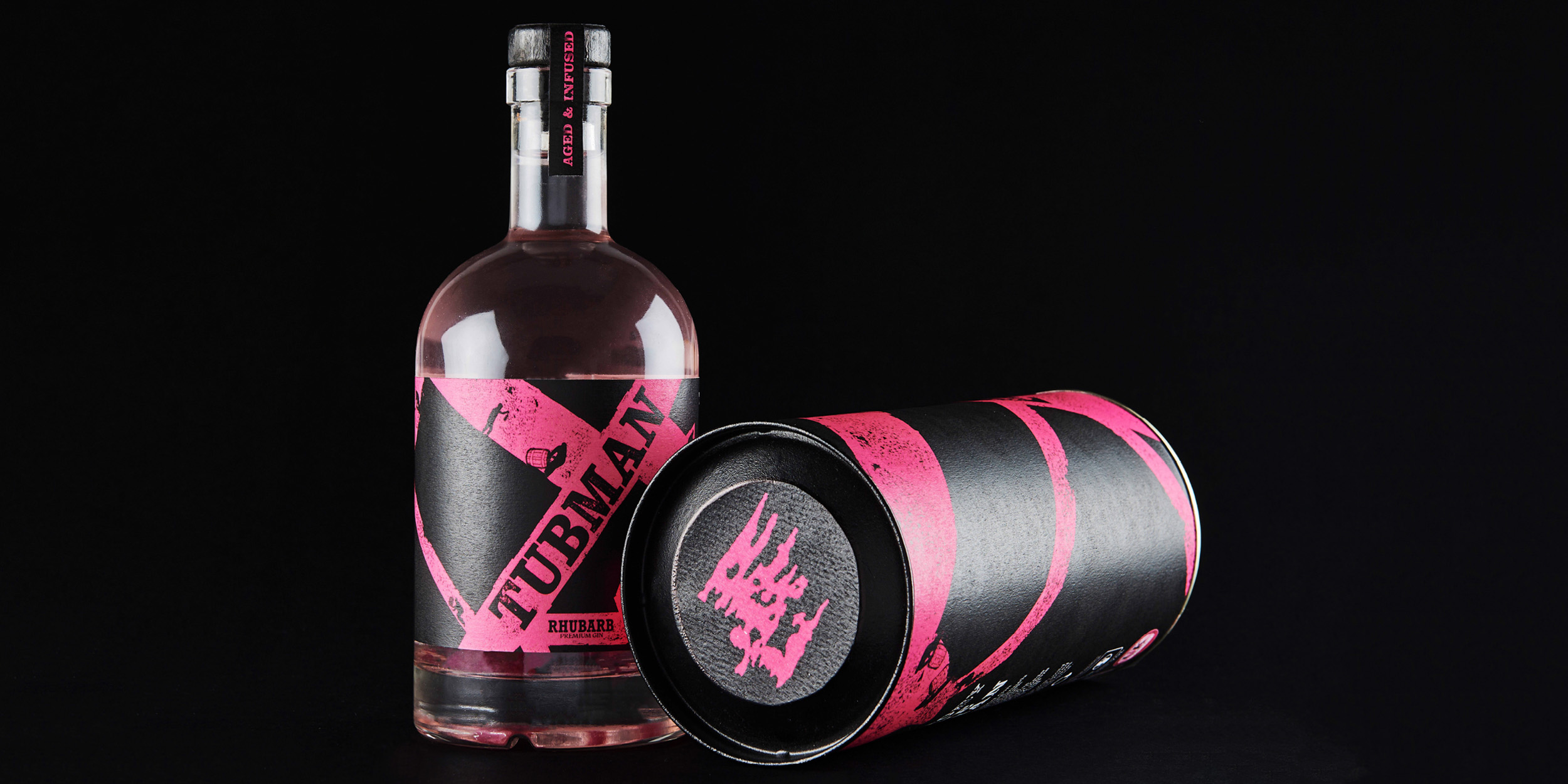 Design work by Cian Paige, showcasing the bottle and packaging in its vibrant pink rhubarb inspired hue.