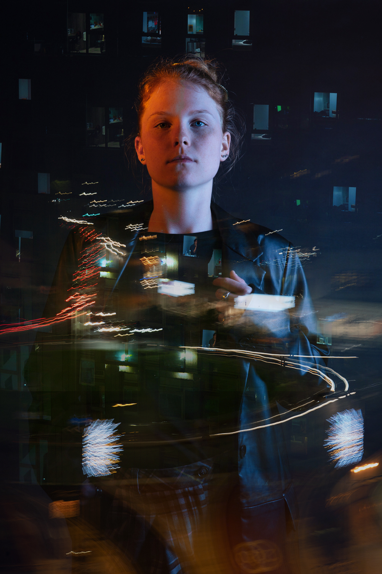 Photography work by Elise Moloney showing a portrait using the double exposure technique with city lights images