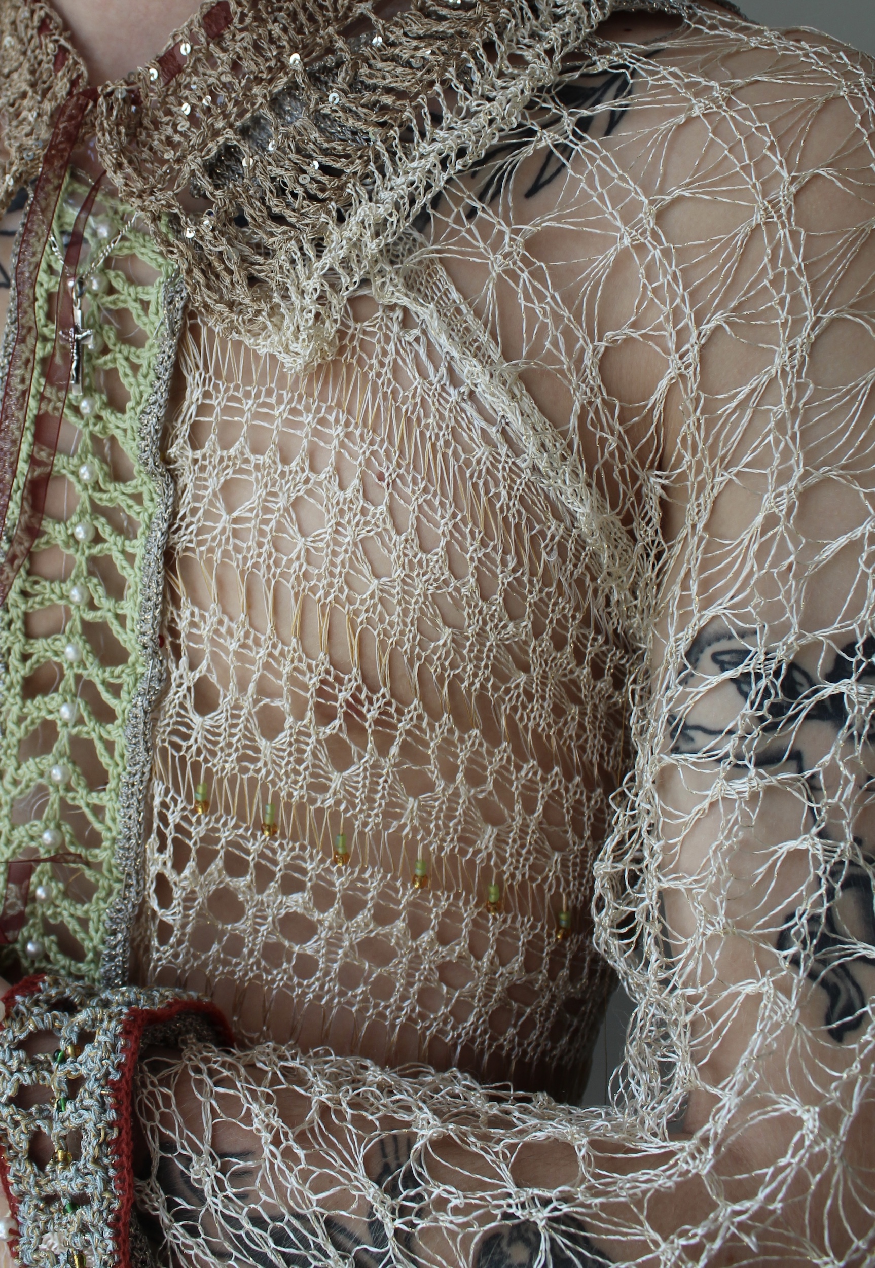 Close up of Model wearing lace fabrics displayed in a shirt context by Elodie Reid-Williams