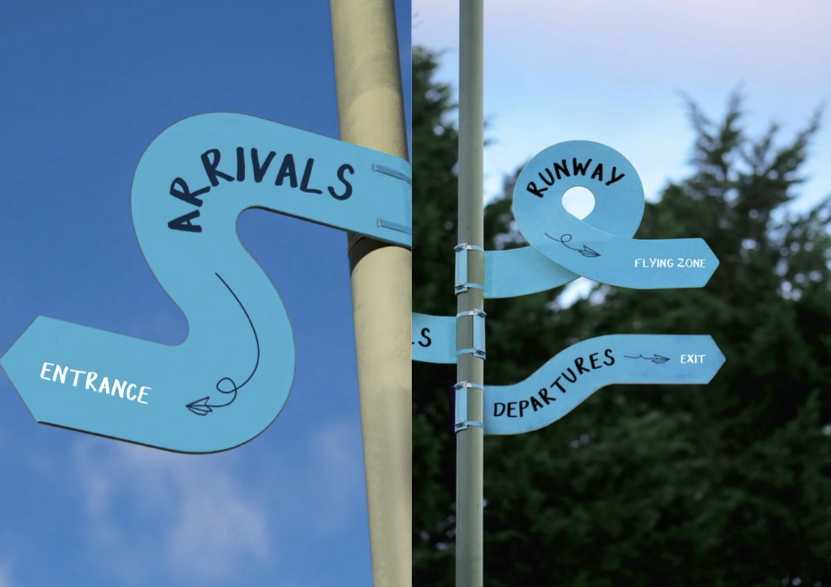 Blue signage made from different shapes to help guide you through the festival.