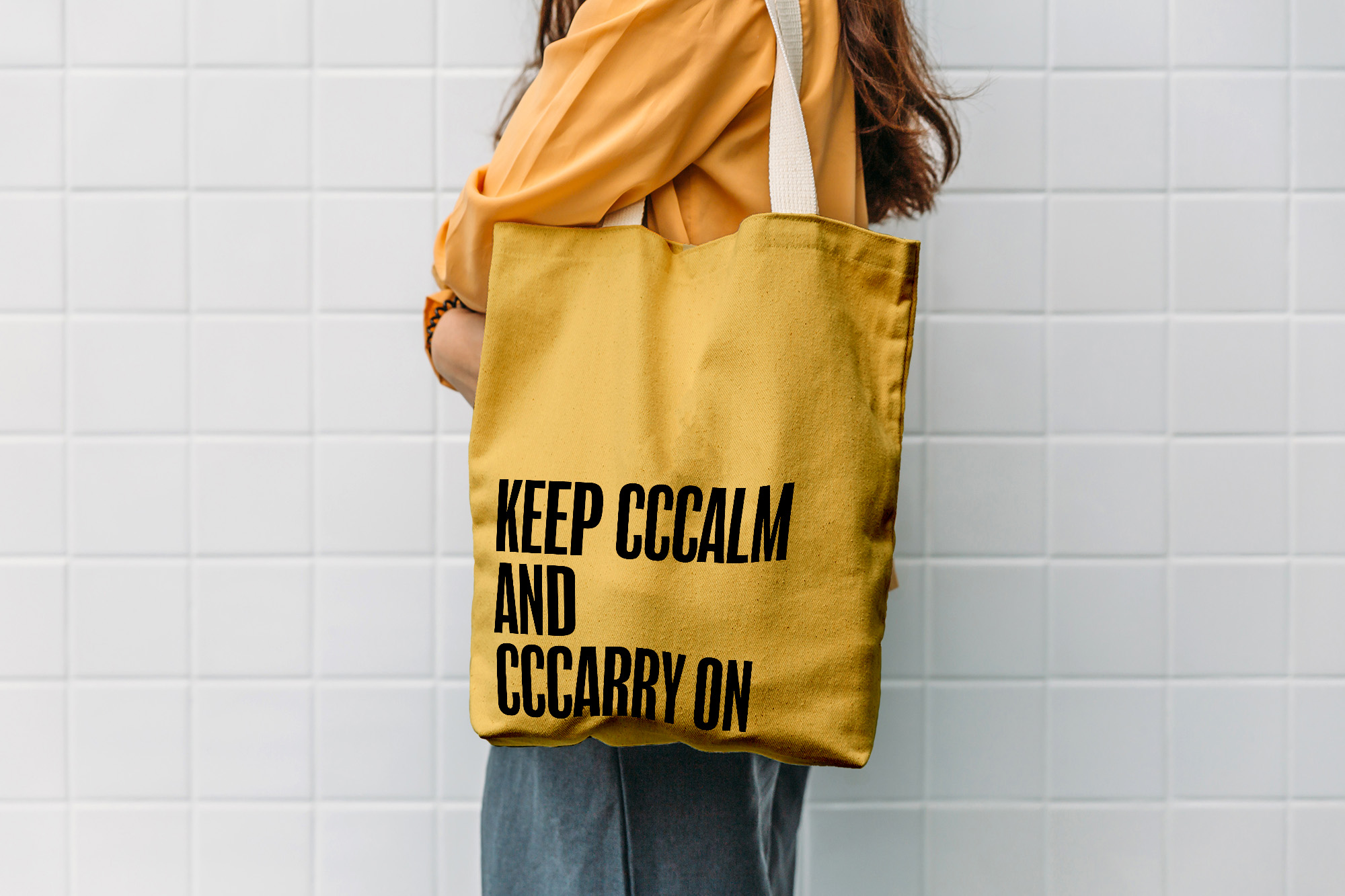 A tote bag, with the copy 'Keep cccalm and cccarry on' applied - linking a phrase used towards those who stutter and the function of the bag.