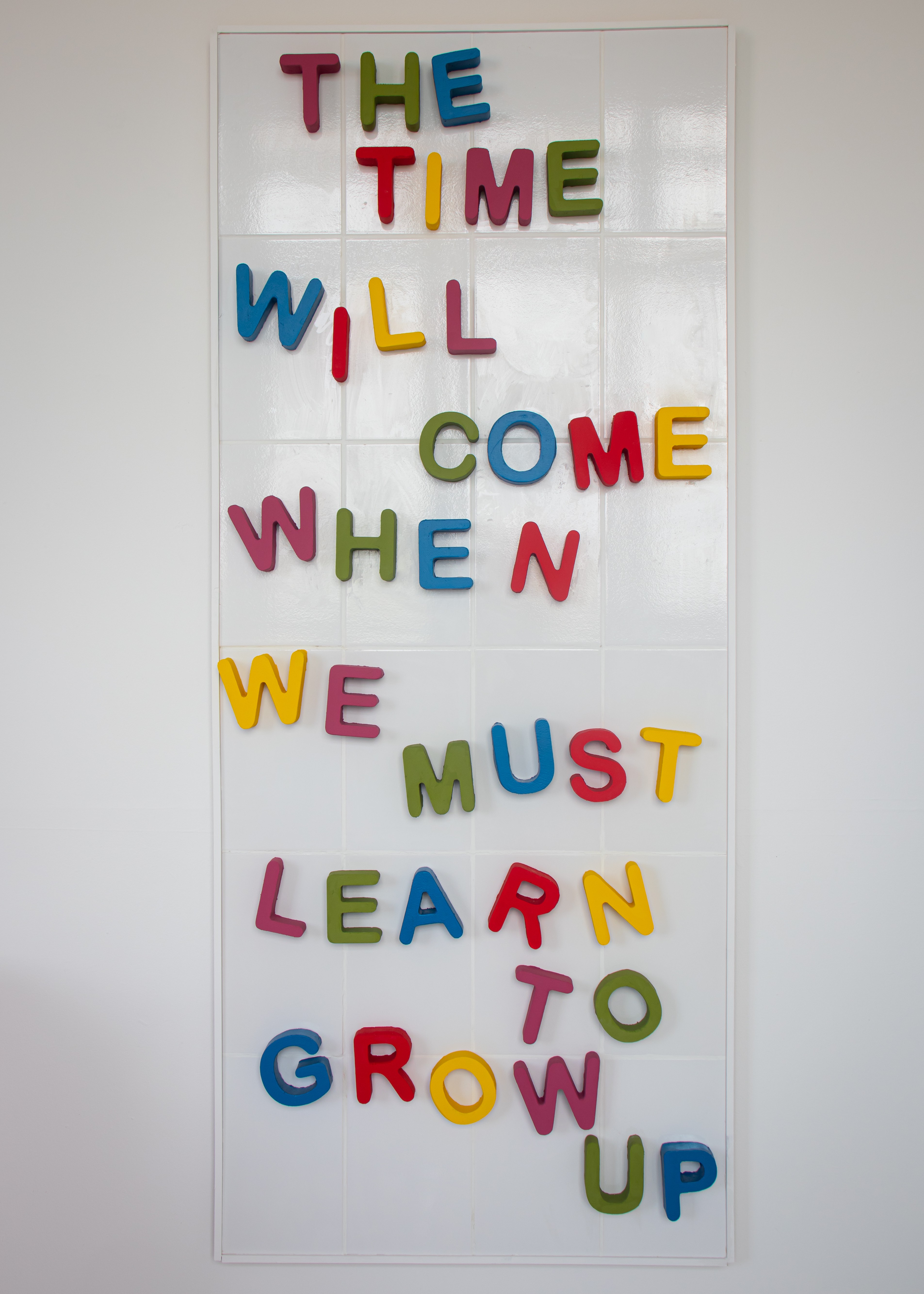 Fine Art work by Georgia Keeling showing a tiled wall with foam lettered sculptures