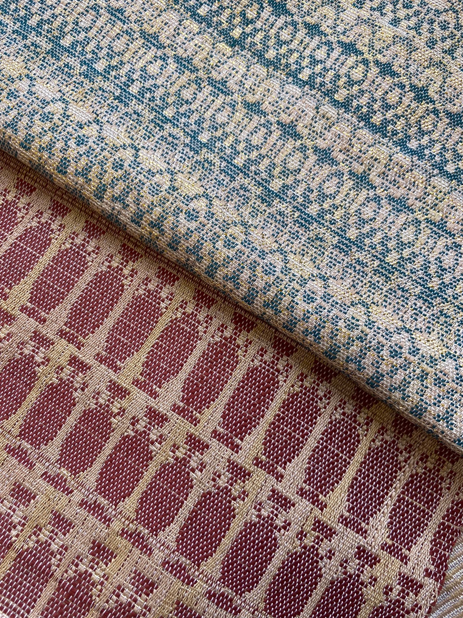 Close up of two woven samples, made with cotton and linen.