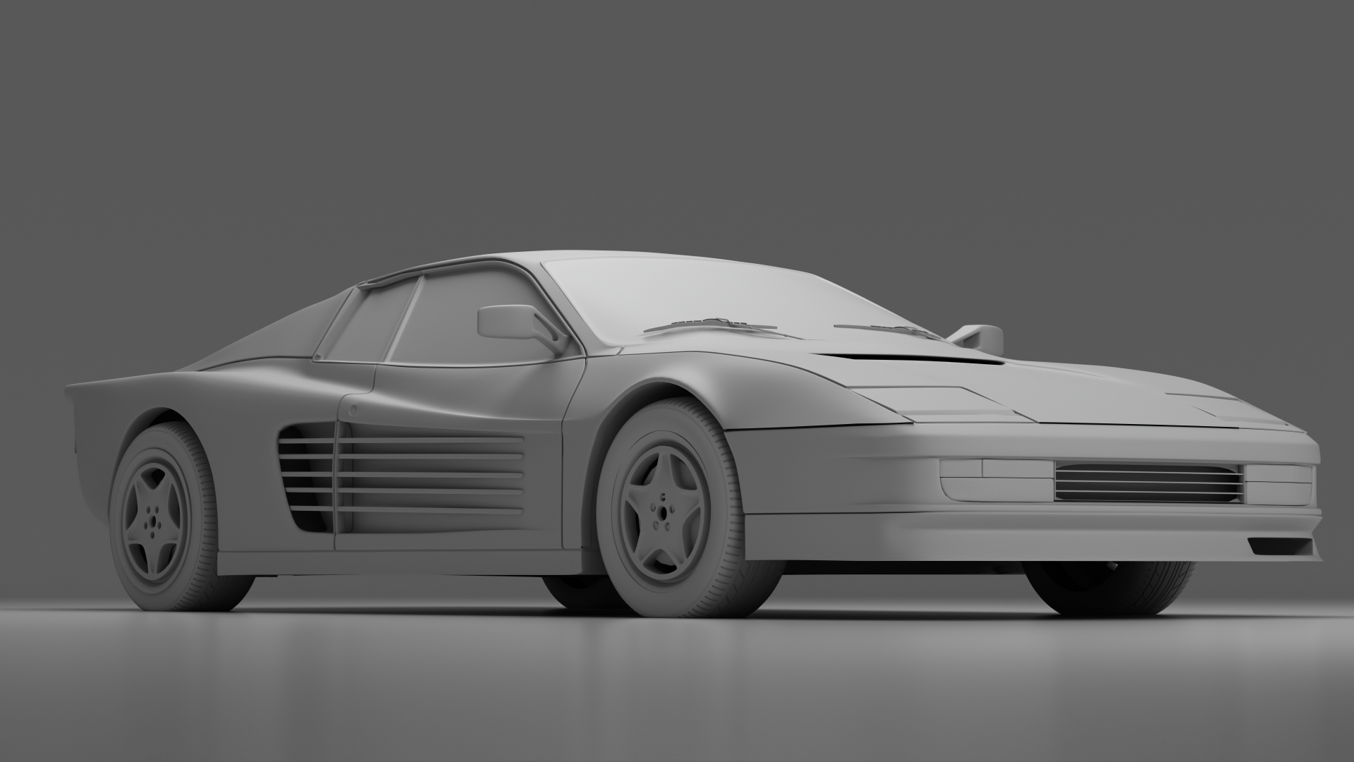 A realistic 3D model of a Ferrari Testarossa by Harry Hughes presented from a low angle using studio lighting.