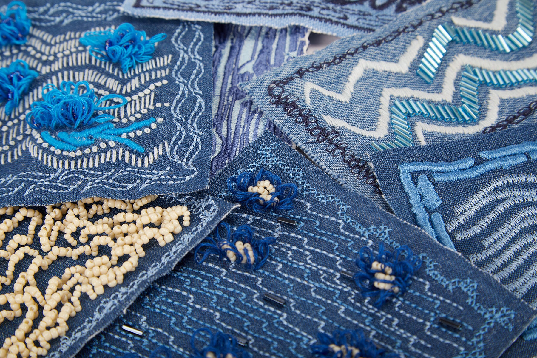 Close up image of hand embroidered repair patches by Isabel Sadnerson