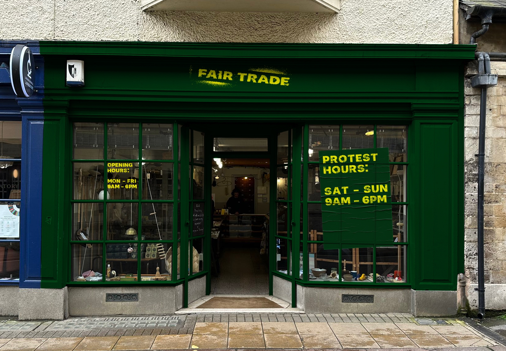 A shopfront for the brand Fair Trade, showing a dark green shopfront with bold yellow typography.