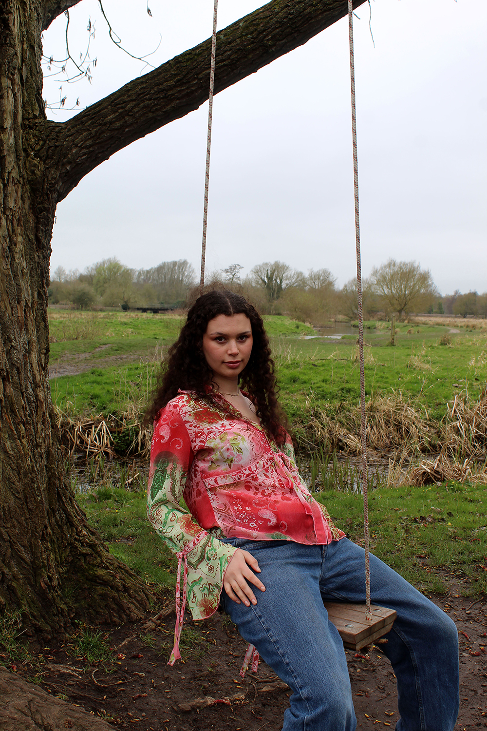Fashion Portrait of model sat in tree swing by Katie Healy exploring Eco Conscious Youths
