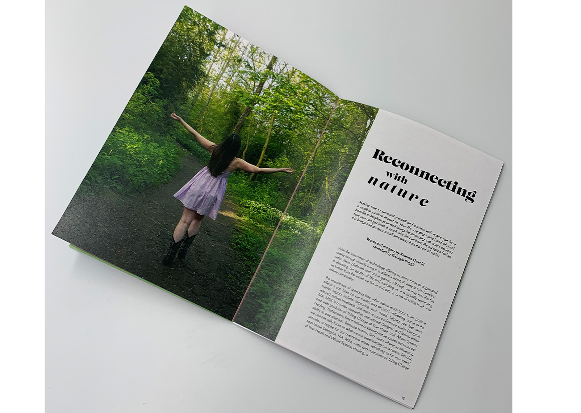 Photograph of spread from Oneself magazine with model arms spread in nature as a large image and some text to the right.