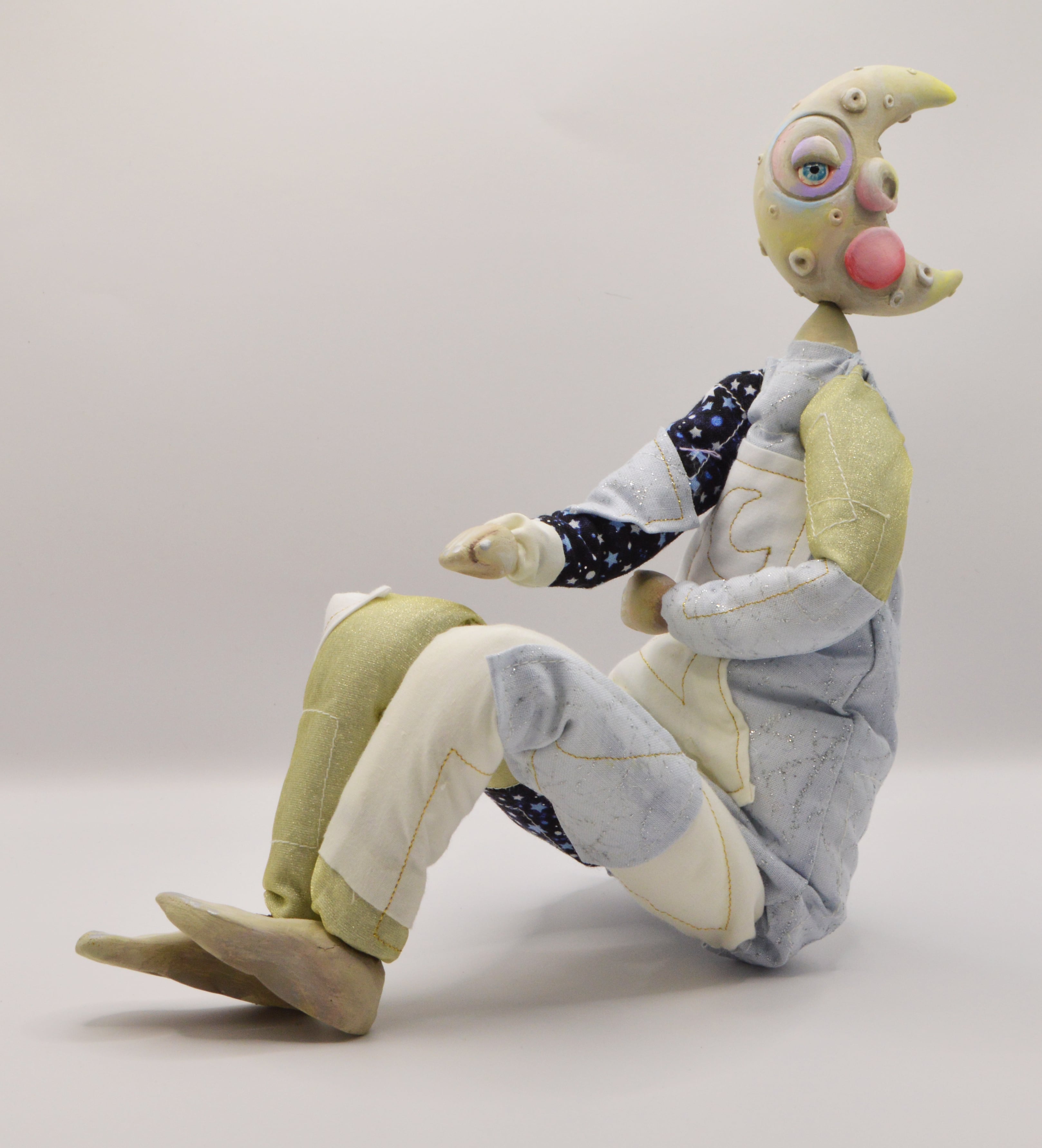 Fine Art work by Kimberley Gaskin showing a moon faced doll with a patchwork body.