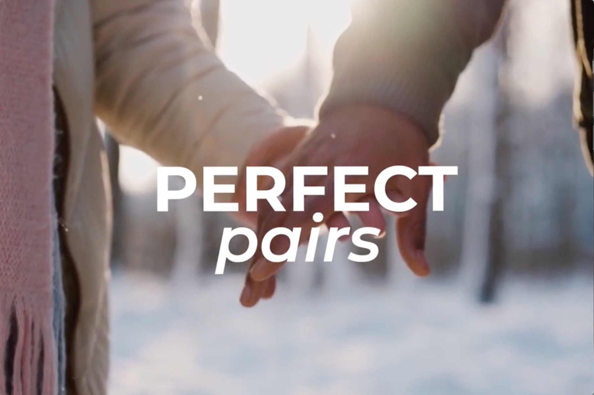 a video presenting a collaboration between tinder and happy socks. Thumbnail says 'perfect pairs' in white over a close up image of holding hands.