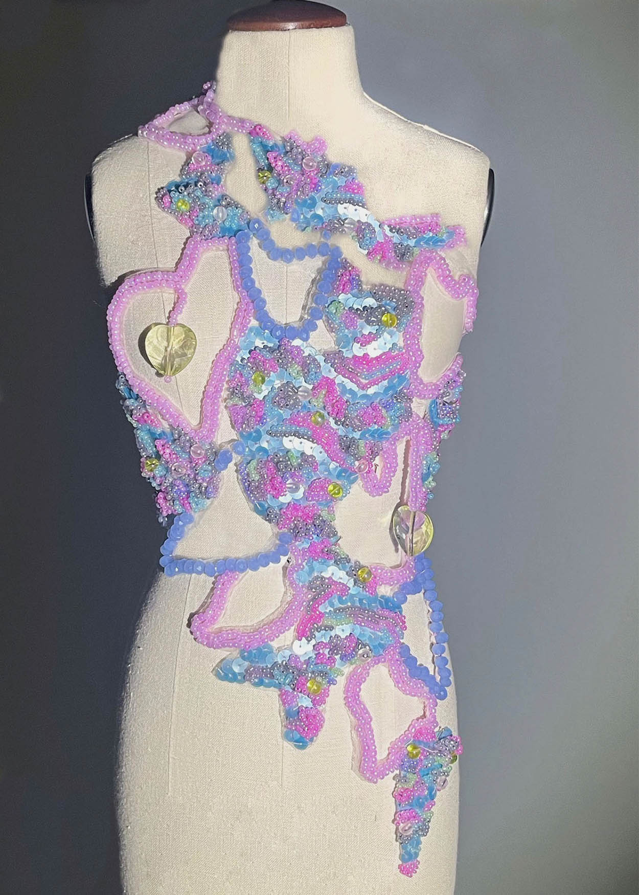 Beaded structure fashioned as a top on a mannequin by Tash Conquest.
