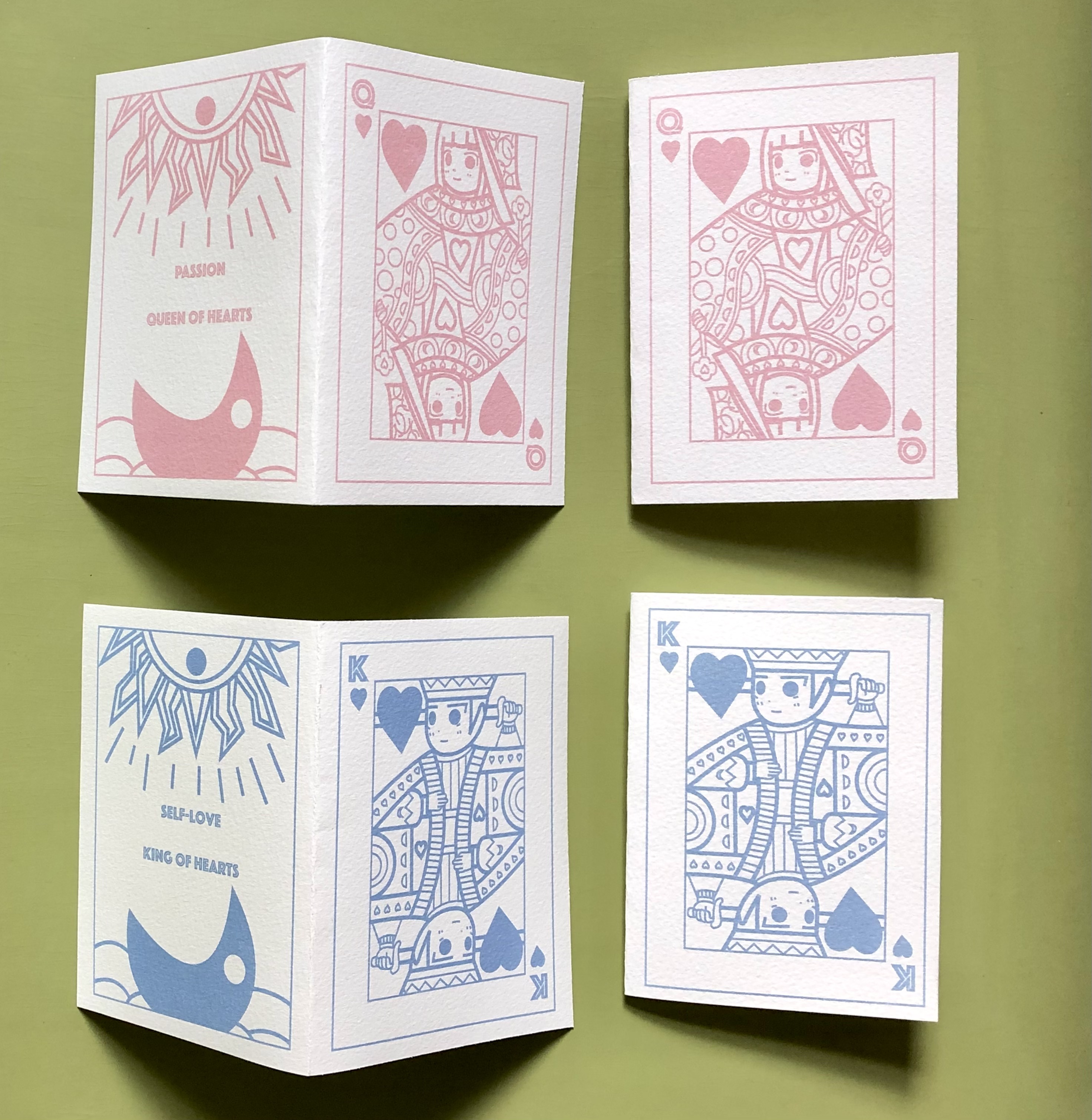 Greeting card designs by Pui Ki Tse. Pale blue and red coloured designs on white card. Design reminiscent of playing cards.