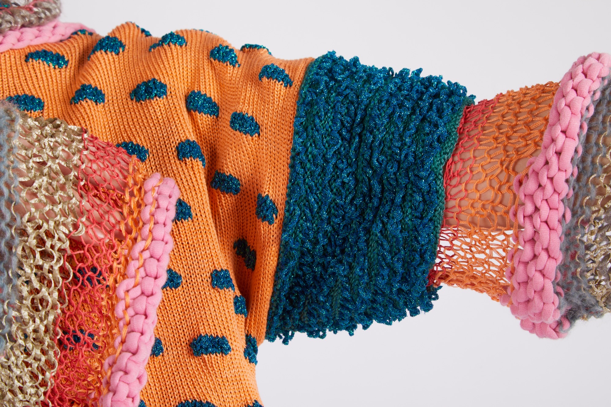 Be Bold garment by Ria Drake. Showing a close-up of a playful garment that combines different reclaimed fibres.