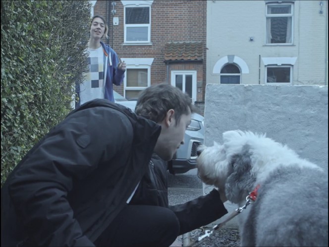 Still from the film Man's Best Friend showing Mark interrupt Liam leaving his house with his dog.