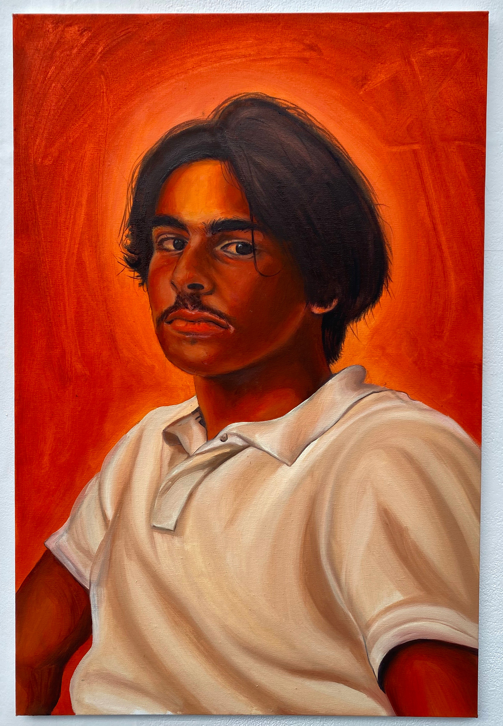 Oil painting by Yasmin Shah depicting her brother, using all orange tones.